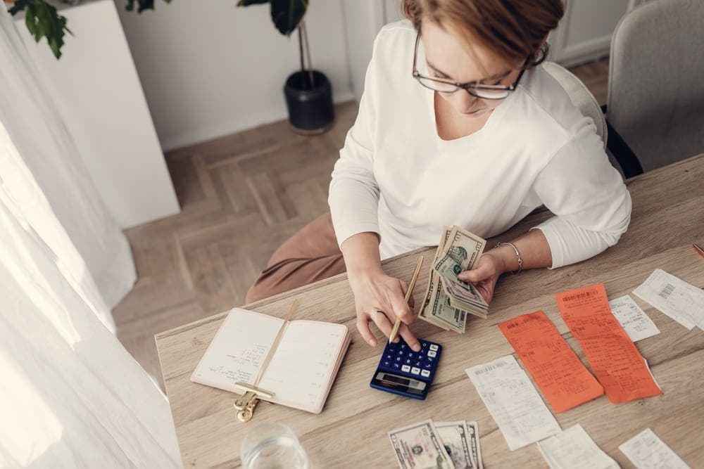 Household bills and a calculator on a table