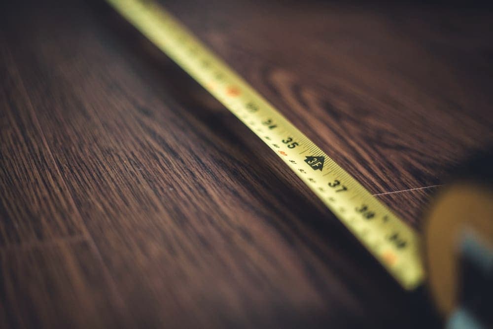A measuring tape on a wooden surface